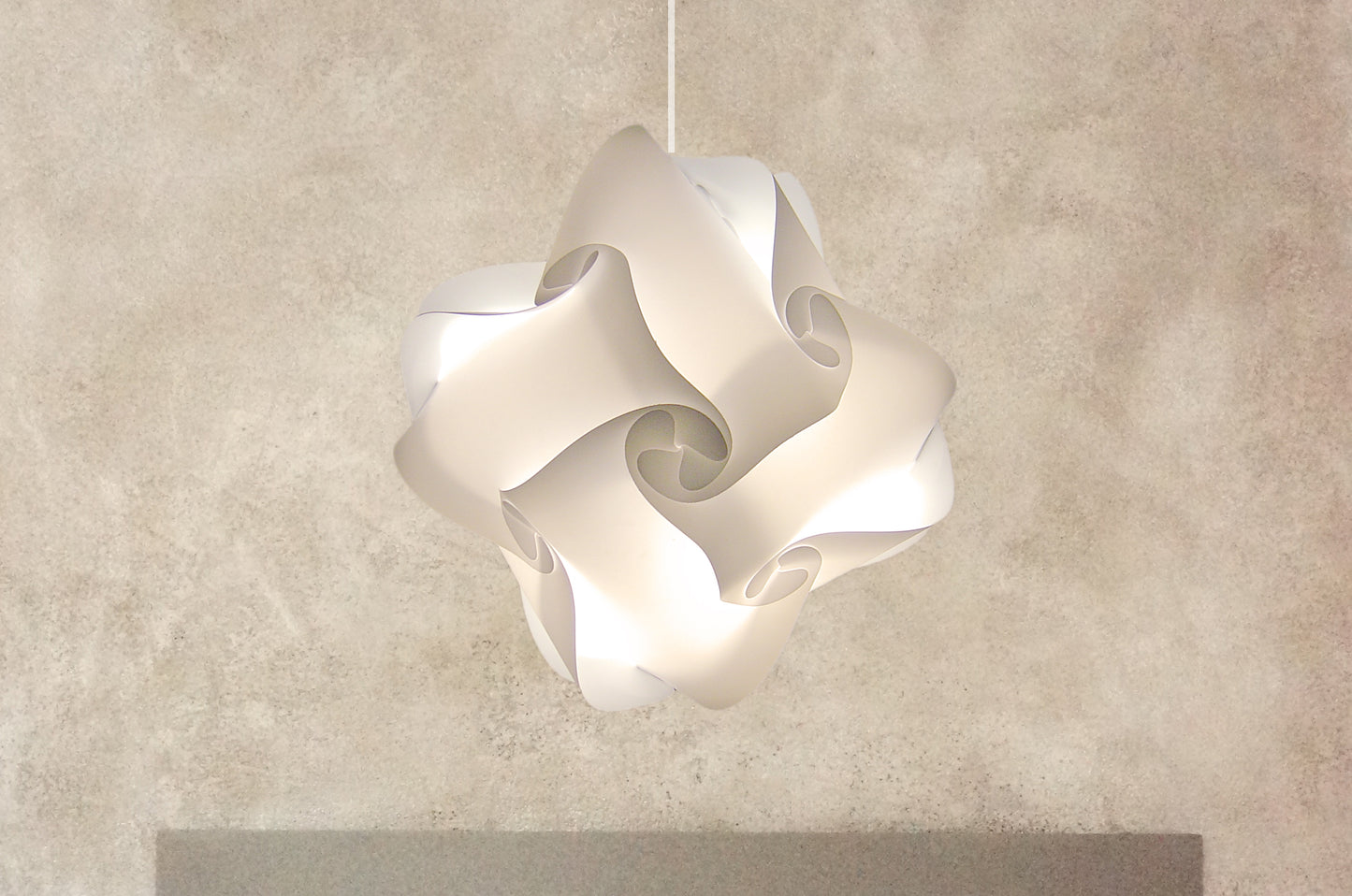 Elegant white Smarty Lamps Axelle Ceiling Lampshade, featuring a sculptural, floral-inspired design suspended against a neutral background.