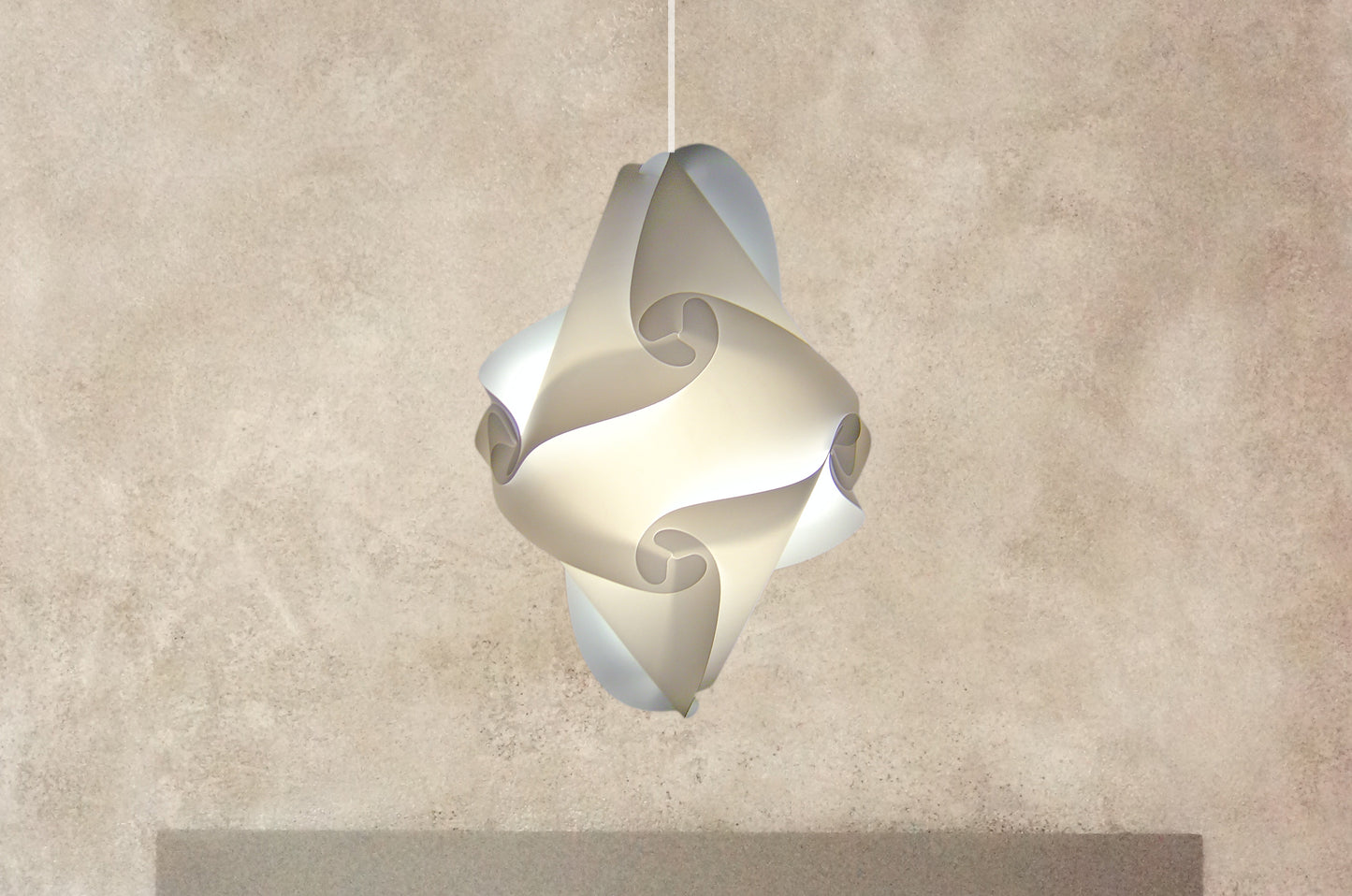 Elegant modern white lampshade in a spiral design, hanging against a neutral background, providing soft ambient lighting for a stylish interior.