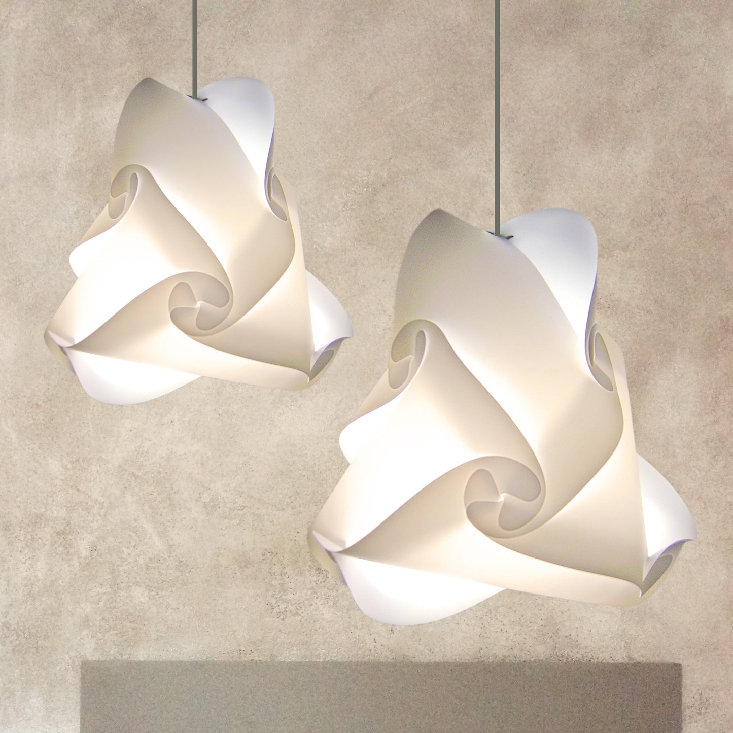 Elegant white swirling lampshades illuminated in minimalist interior