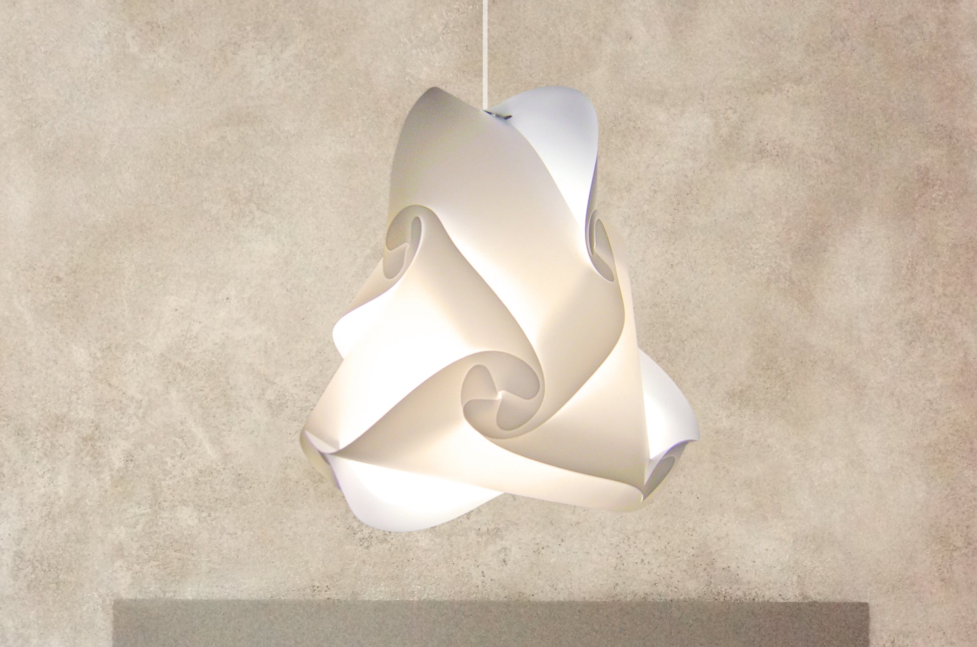 Modern white swirling ceiling lampshade with delicate curved design for ambient lighting in home interior.