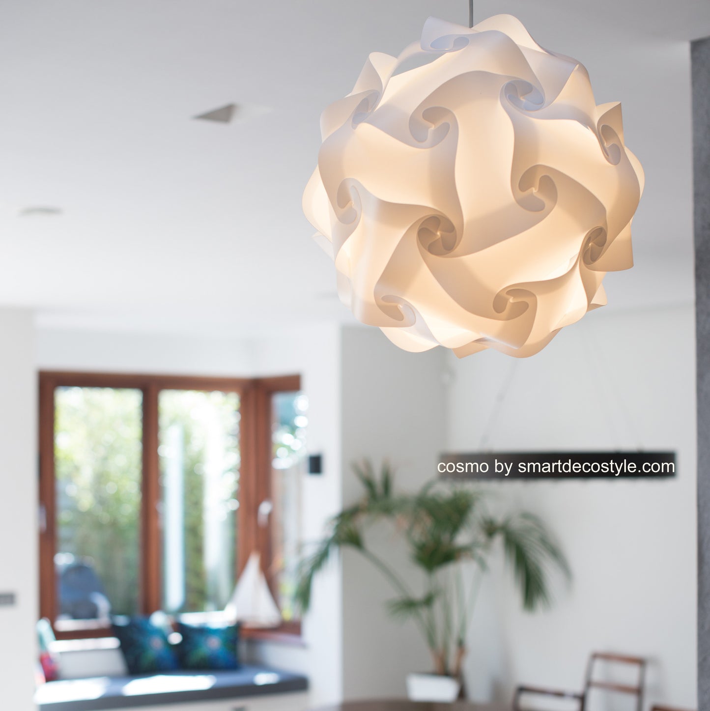 Elegant white Cosmo light shade hanging in modern interior